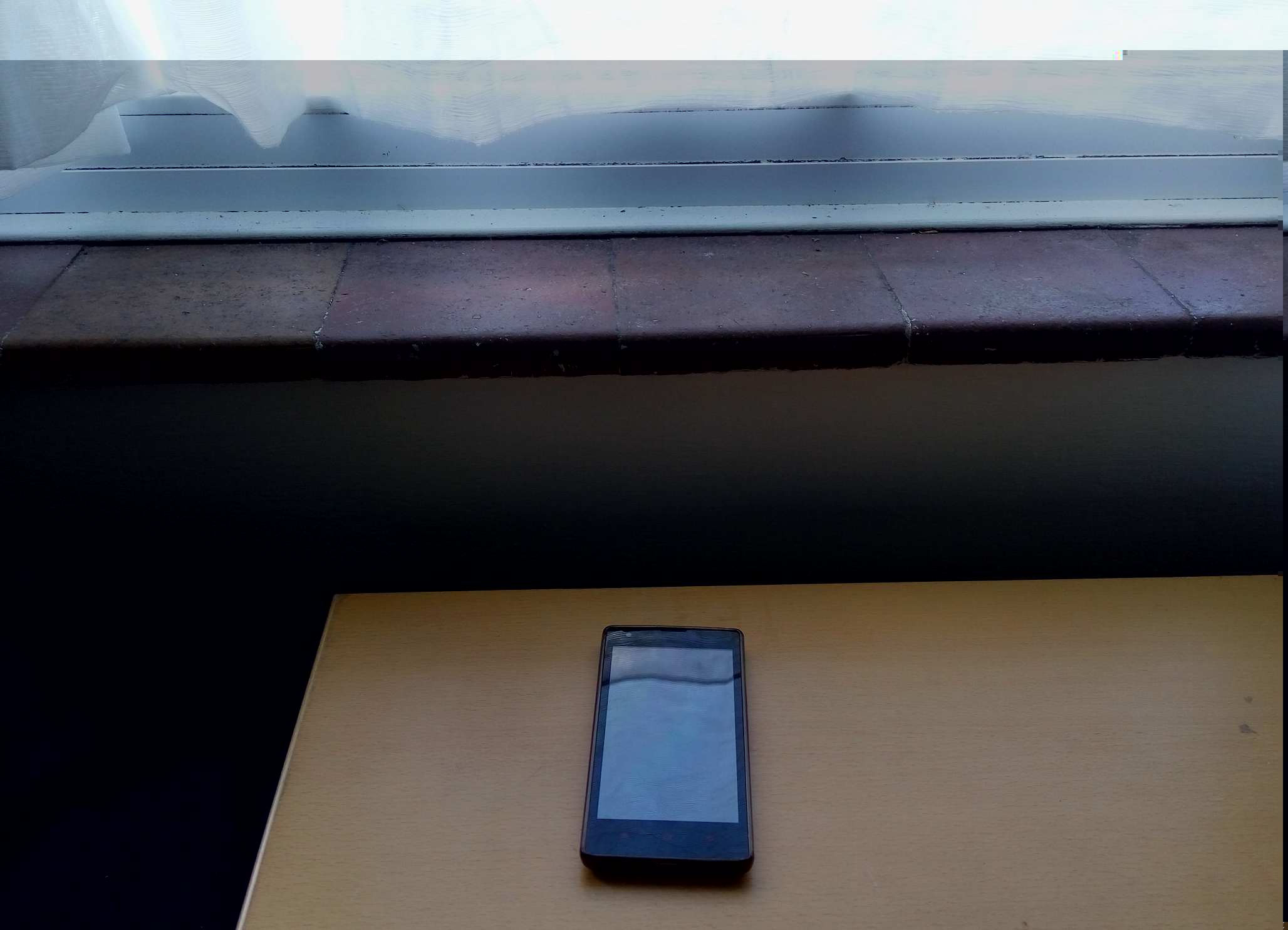 Mobile Phone by a window